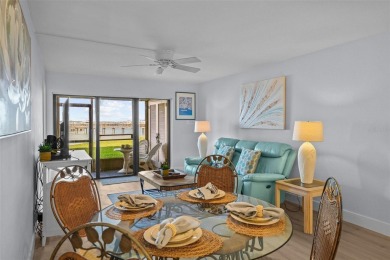 Casa Del Mar Villa.  With stunning water views, this first floor on Isla Del Sol Yacht and Country Club in Florida - for sale on GolfHomes.com, golf home, golf lot