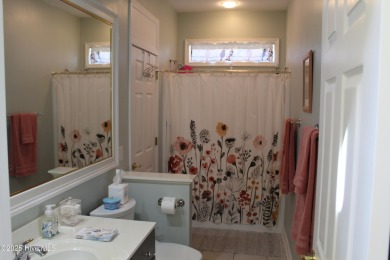 YOU WILL DISCOVER TRANQUIL POND VIEWS & COASTAL COMFORT IN THIS on Ocean Ridge Plantation in North Carolina - for sale on GolfHomes.com, golf home, golf lot
