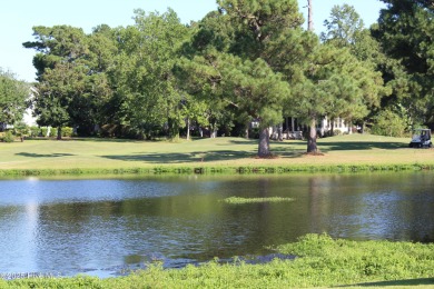 YOU WILL DISCOVER TRANQUIL POND VIEWS & COASTAL COMFORT IN THIS on Ocean Ridge Plantation in North Carolina - for sale on GolfHomes.com, golf home, golf lot
