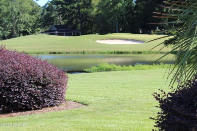 YOU WILL DISCOVER TRANQUIL POND VIEWS & COASTAL COMFORT IN THIS on Ocean Ridge Plantation in North Carolina - for sale on GolfHomes.com, golf home, golf lot