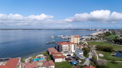 Casa Del Mar Villa.  With stunning water views, this first floor on Isla Del Sol Yacht and Country Club in Florida - for sale on GolfHomes.com, golf home, golf lot