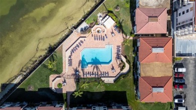 Casa Del Mar Villa.  With stunning water views, this first floor on Isla Del Sol Yacht and Country Club in Florida - for sale on GolfHomes.com, golf home, golf lot