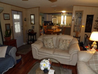 Partially furnished 2 BR 2 BA 14 x 60 mobile home with a 12 X 14 on Crystal Lake Club in Florida - for sale on GolfHomes.com, golf home, golf lot