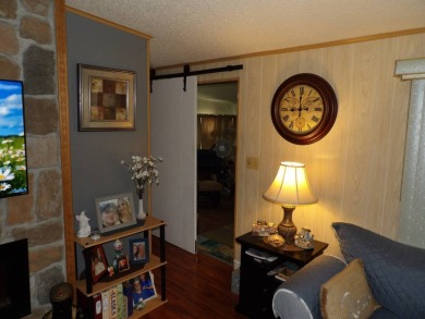 Partially furnished 2 BR 2 BA 14 x 60 mobile home with a 12 X 14 on Crystal Lake Club in Florida - for sale on GolfHomes.com, golf home, golf lot
