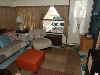 Partially furnished 2 BR 2 BA 14 x 60 mobile home with a 12 X 14 on Crystal Lake Club in Florida - for sale on GolfHomes.com, golf home, golf lot