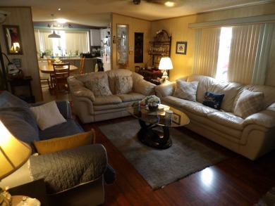 Partially furnished 2 BR 2 BA 14 x 60 mobile home with a 12 X 14 on Crystal Lake Club in Florida - for sale on GolfHomes.com, golf home, golf lot