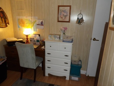 Partially furnished 2 BR 2 BA 14 x 60 mobile home with a 12 X 14 on Crystal Lake Club in Florida - for sale on GolfHomes.com, golf home, golf lot
