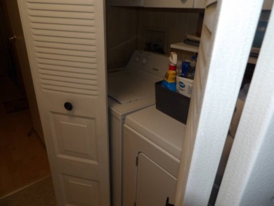 Partially furnished 2 BR 2 BA 14 x 60 mobile home with a 12 X 14 on Crystal Lake Club in Florida - for sale on GolfHomes.com, golf home, golf lot