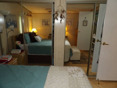 Partially furnished 2 BR 2 BA 14 x 60 mobile home with a 12 X 14 on Crystal Lake Club in Florida - for sale on GolfHomes.com, golf home, golf lot