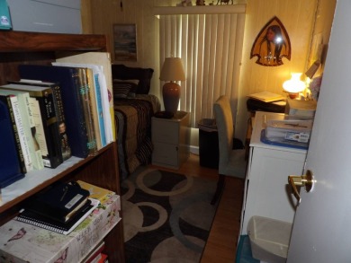 Partially furnished 2 BR 2 BA 14 x 60 mobile home with a 12 X 14 on Crystal Lake Club in Florida - for sale on GolfHomes.com, golf home, golf lot