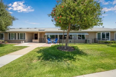 Nestled behind mature trees, this charming home offers a serene on Leisure World Seal Beach Golf Course in California - for sale on GolfHomes.com, golf home, golf lot
