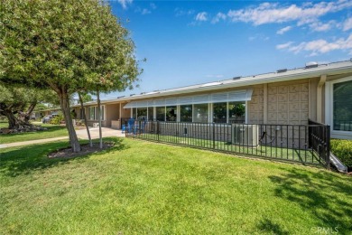 Nestled behind mature trees, this charming home offers a serene on Leisure World Seal Beach Golf Course in California - for sale on GolfHomes.com, golf home, golf lot