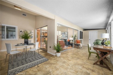 Nestled behind mature trees, this charming home offers a serene on Leisure World Seal Beach Golf Course in California - for sale on GolfHomes.com, golf home, golf lot