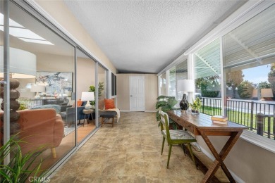 Nestled behind mature trees, this charming home offers a serene on Leisure World Seal Beach Golf Course in California - for sale on GolfHomes.com, golf home, golf lot