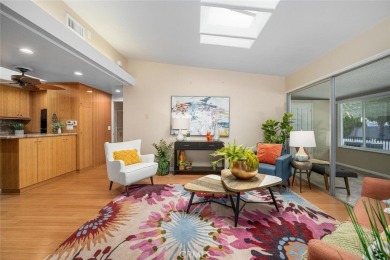 Nestled behind mature trees, this charming home offers a serene on Leisure World Seal Beach Golf Course in California - for sale on GolfHomes.com, golf home, golf lot