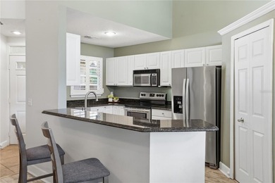 Located in gated Barclay Place, this end unit condominium offers on Heathrow Country Club in Florida - for sale on GolfHomes.com, golf home, golf lot