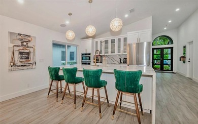 Fall in love instantly with this beautifully renovated lakefront on Grand Palms Hotel and Golf Resort in Florida - for sale on GolfHomes.com, golf home, golf lot