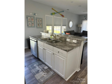 This beautifully updated third-floor condo is located in the on Sea Trail Golf Resort in North Carolina - for sale on GolfHomes.com, golf home, golf lot