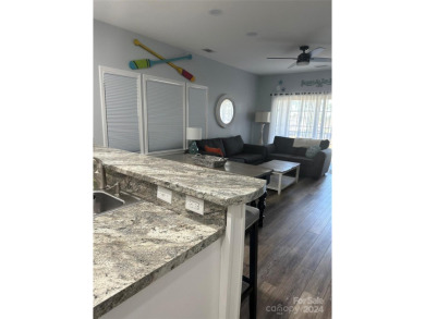 This beautifully updated third-floor condo is located in the on Sea Trail Golf Resort in North Carolina - for sale on GolfHomes.com, golf home, golf lot