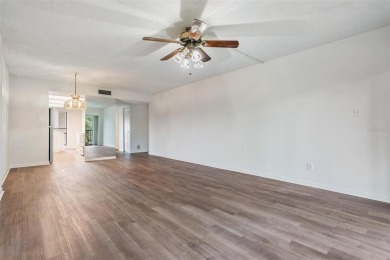 This spacious, light and bright fourth floor condo has a lovely on Cove Cay Country Club in Florida - for sale on GolfHomes.com, golf home, golf lot