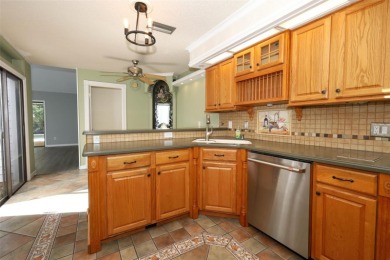 Beautiful Home with huge Sparkling Screened Pool with Private on Rio Pinar Golf and Country Club in Florida - for sale on GolfHomes.com, golf home, golf lot