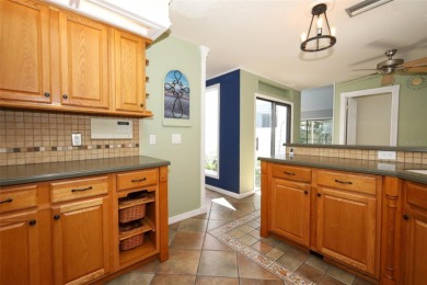 Beautiful Home with huge Sparkling Screened Pool with Private on Rio Pinar Golf and Country Club in Florida - for sale on GolfHomes.com, golf home, golf lot