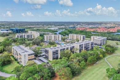 This spacious, light and bright fourth floor condo has a lovely on Cove Cay Country Club in Florida - for sale on GolfHomes.com, golf home, golf lot