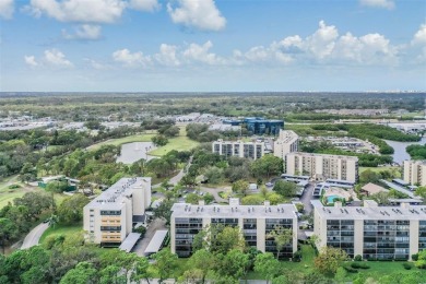 This spacious, light and bright fourth floor condo has a lovely on Cove Cay Country Club in Florida - for sale on GolfHomes.com, golf home, golf lot