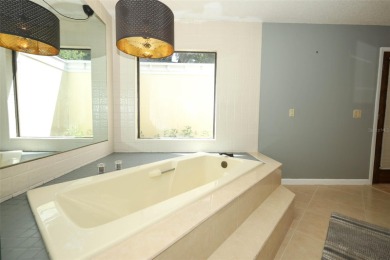 Beautiful Home with huge Sparkling Screened Pool with Private on Rio Pinar Golf and Country Club in Florida - for sale on GolfHomes.com, golf home, golf lot