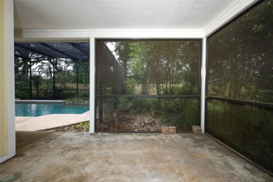 Beautiful Home with huge Sparkling Screened Pool with Private on Rio Pinar Golf and Country Club in Florida - for sale on GolfHomes.com, golf home, golf lot