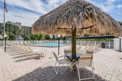 This spacious, light and bright fourth floor condo has a lovely on Cove Cay Country Club in Florida - for sale on GolfHomes.com, golf home, golf lot