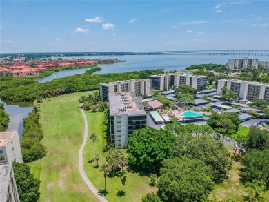 This spacious, light and bright fourth floor condo has a lovely on Cove Cay Country Club in Florida - for sale on GolfHomes.com, golf home, golf lot