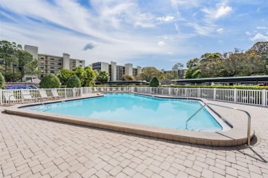 This spacious, light and bright fourth floor condo has a lovely on Cove Cay Country Club in Florida - for sale on GolfHomes.com, golf home, golf lot