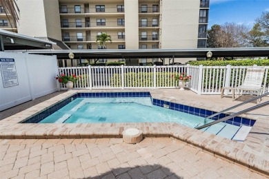 This spacious, light and bright fourth floor condo has a lovely on Cove Cay Country Club in Florida - for sale on GolfHomes.com, golf home, golf lot