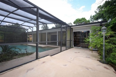 Beautiful Home with huge Sparkling Screened Pool with Private on Rio Pinar Golf and Country Club in Florida - for sale on GolfHomes.com, golf home, golf lot