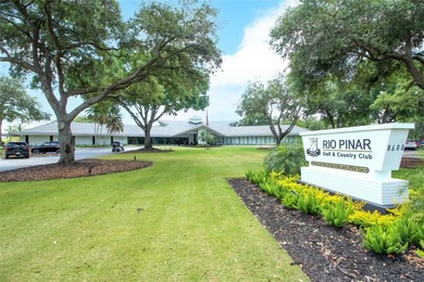 Beautiful Home with huge Sparkling Screened Pool with Private on Rio Pinar Golf and Country Club in Florida - for sale on GolfHomes.com, golf home, golf lot