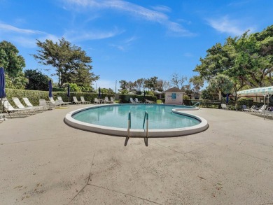 Charming 4th floor unit in elevator building. Wonderful Lake on Marina Lakes Golf Course in Florida - for sale on GolfHomes.com, golf home, golf lot