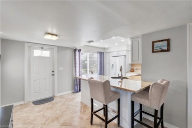 Discover this beautiful move-in-ready first-floor end unit in on The Glades Golf and Country Club in Florida - for sale on GolfHomes.com, golf home, golf lot