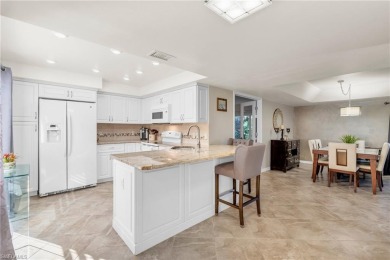 Discover this beautiful move-in-ready first-floor end unit in on The Glades Golf and Country Club in Florida - for sale on GolfHomes.com, golf home, golf lot