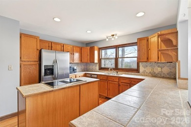 Located just moments from downtown Black Mountain, this on Black Mountain Golf Course in North Carolina - for sale on GolfHomes.com, golf home, golf lot