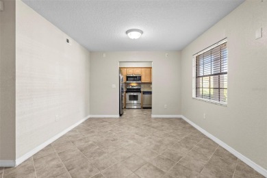 Welcome to this 2-bedroom, 1-bathroom, GROUND-FLOOR condo in on Pasadena Yacht and Country Club in Florida - for sale on GolfHomes.com, golf home, golf lot