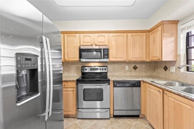 Welcome to this 2-bedroom, 1-bathroom, GROUND-FLOOR condo in on Pasadena Yacht and Country Club in Florida - for sale on GolfHomes.com, golf home, golf lot