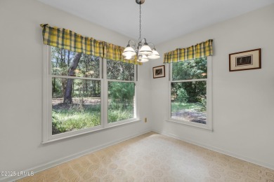 Welcome to this charming ranch-style home on Lady's Island on Ladys Island Country Club in South Carolina - for sale on GolfHomes.com, golf home, golf lot