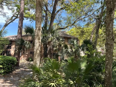 Escape to a peaceful, tree-lined oasis in this beautifully on Palm Harbor Golf Club in Florida - for sale on GolfHomes.com, golf home, golf lot