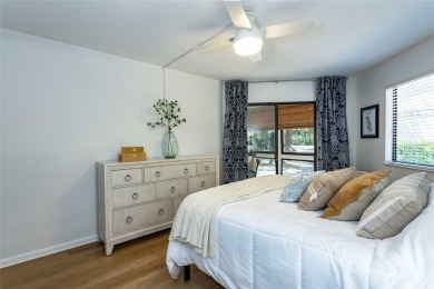 Escape to a peaceful, tree-lined oasis in this beautifully on Palm Harbor Golf Club in Florida - for sale on GolfHomes.com, golf home, golf lot
