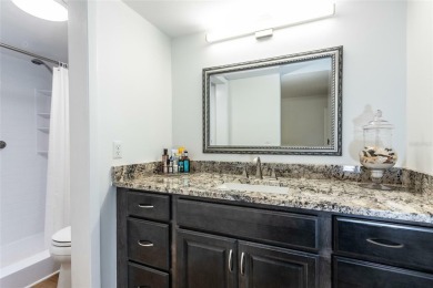 Escape to a peaceful, tree-lined oasis in this beautifully on Palm Harbor Golf Club in Florida - for sale on GolfHomes.com, golf home, golf lot