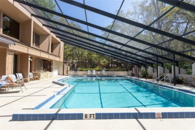 Escape to a peaceful, tree-lined oasis in this beautifully on Palm Harbor Golf Club in Florida - for sale on GolfHomes.com, golf home, golf lot