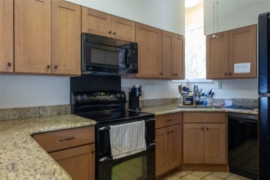 Escape to a peaceful, tree-lined oasis in this beautifully on Palm Harbor Golf Club in Florida - for sale on GolfHomes.com, golf home, golf lot