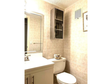 RENOVATED FRESH PAINT EXPANSIVE WATER VIEW WALK TO HOUSES OF on Hillsboro Pines Golf in Florida - for sale on GolfHomes.com, golf home, golf lot