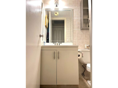 RENOVATED FRESH PAINT EXPANSIVE WATER VIEW WALK TO HOUSES OF on Hillsboro Pines Golf in Florida - for sale on GolfHomes.com, golf home, golf lot